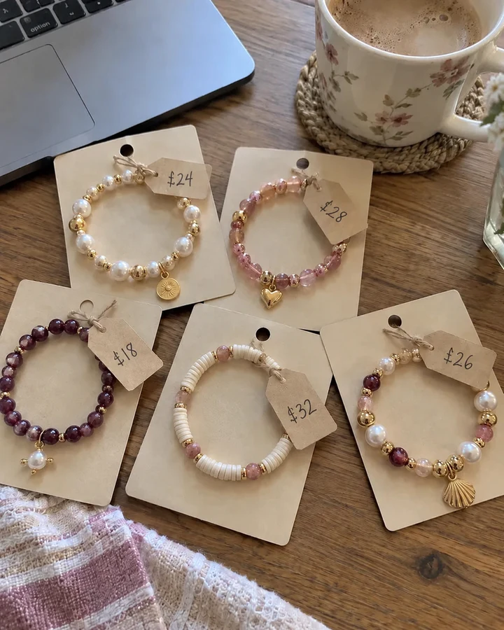 Handmade beaded bracelets on display cards with small price tags